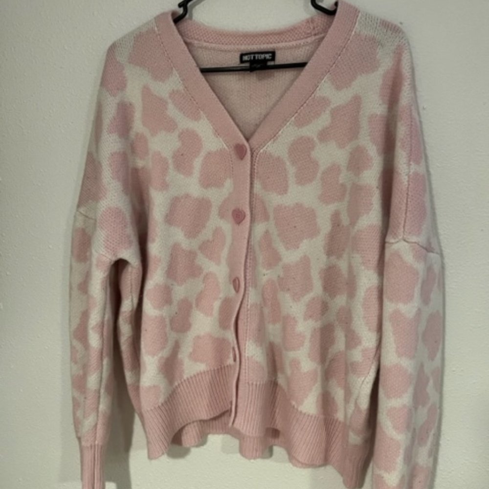 pink and white cow print sweater